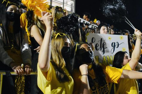 Among the sea of black and yellow, thousands of Sunny Hills students cheer for the football team that was playing against Troy High School during the Oct. 15 homecoming game. Orange County Register reporter, Manny Alvarez, recognized the Sunny Hills Lancer Nation as the OCVarsity Student Section Champion, Oct. 18.