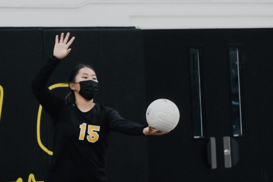 Setter junior Jacky Woo gets ready to serve the ball against Buena Park High School’s girls volleyball team in an Oct. 5 home game that the Lady Lancers won in straight sets.