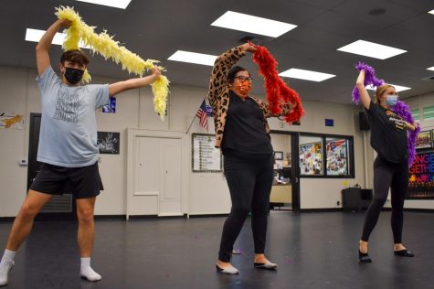 Dance Production senior David Burn (left) practices his routine Monday, Nov. 15, after school in Room 130 with math teacher Cristian Bueno and junior Amber Reuter to prepare for the 10th anniversary of Dancing With the Staff. Tickets for the Dec. 9-10 event will go on sale Dec. 2.