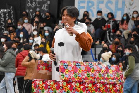 Ready to introduce himself to the audience, senior class vice president Patrick Vincent Jimenez kicks off the winter assembly from a wrapped gift box on Dec. 10. 
