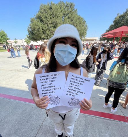 Fullerton Union High School junior Chloe Serrano shows her flyers with information on how to support her petition to amend the districts dress code policy. Since then, the Fullerton Joint Union High School Districts Student Advisory Council has been working to revamp the attire policy so that its more up to date with student fashion trends.