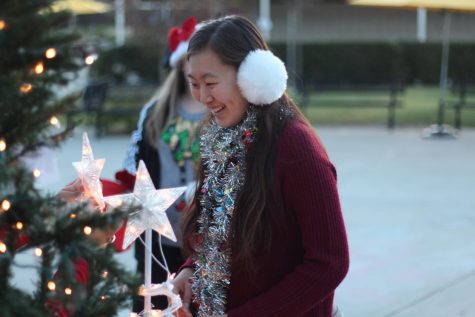 ASB student decorates the Christmas tree in the quad as a part of the 2016 holiday decorations. The annual quad decorations will return this year on Dec. 13.