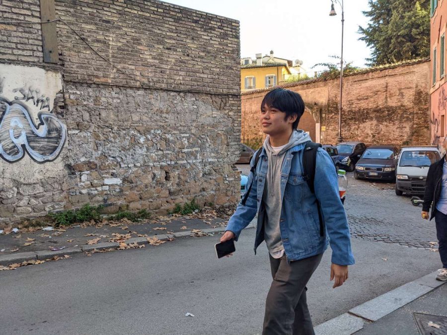 Class of 2021 alumnus Tyler Pak walks to class in Rome on Wednesday. Pak was among those who accepted a spring semester admission offer by USC. 