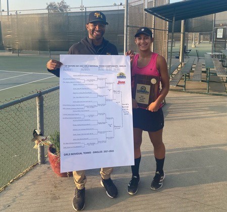 Sunny Hills freshman Daniela Bourrel (right) stands with athletic director Paul Jones (left) after winning the CIF-Southern Section singles title at Whittier Narrows on Dec. 2.