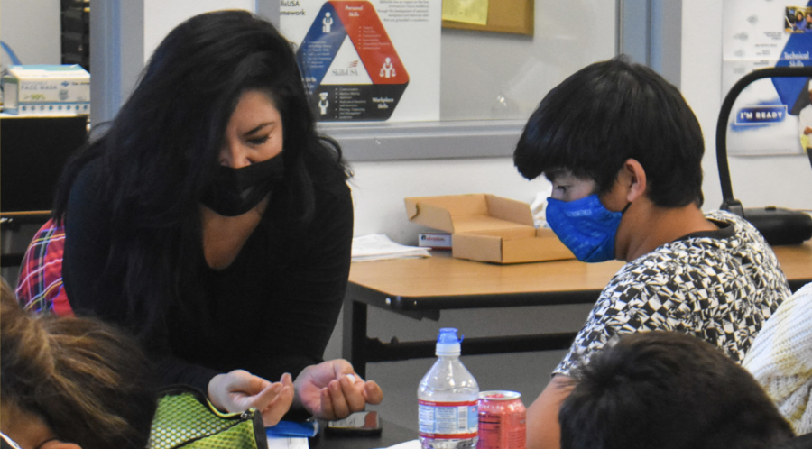 Engineering teacher Gracie Mariner (left) aids sophomore Brandon Cheng during her fourth period Principles of Engineering class on Friday, Nov. 12