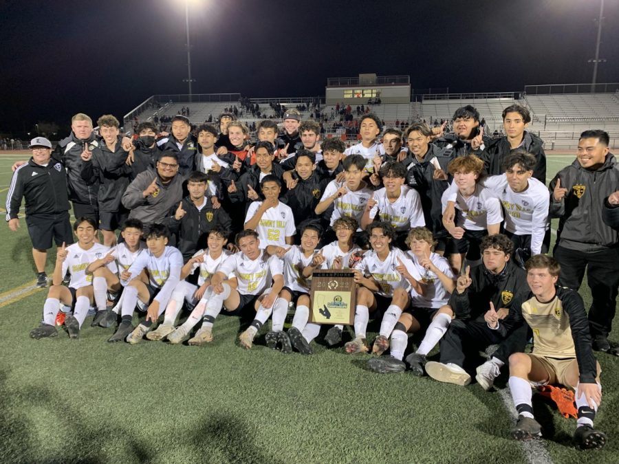 After+accepting+the+CIF-Southern+Section+Division+3+championship+plaque%2C+the+Sunny+Hills+Boys+soccer+players+and+the+coaching+staff+gather+Saturday%2C+Feb.+26%2C+for+a+team+photo.+The+Lancers+defeated+Norte+Vista+1-0+in+overtime+at+Ramona+High+School+in+Riverside+to+claim+a++second+CIF+title+since+2016.