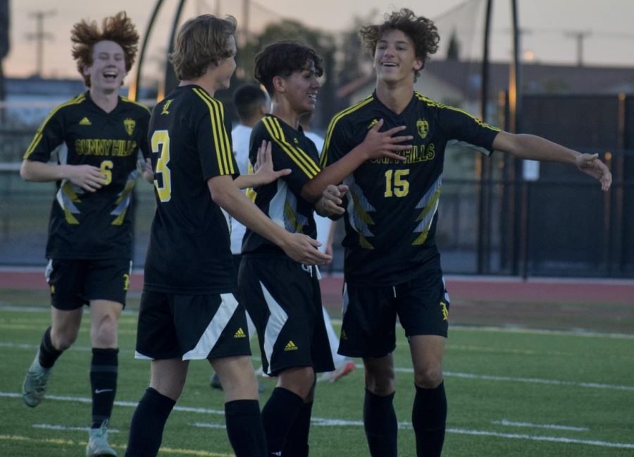 Forward junior Mathias Brown (right) celebrates with his teammates after scoring the Lancers’ first goal in the first round of CIF state regionals against Panorama High School on Tuesday, March 1, at the Buena Park High School stadium. Brown, who was also playing on his birthday, came up with a hat trick with a total of three goals as Sunny Hills won 4-3.