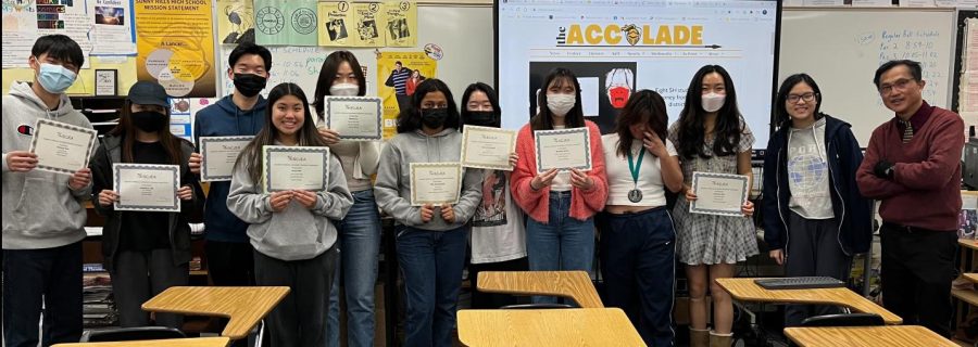 The Accolade staff that competed in the March 12 Student Media Writing Contest at Maywood Center for Enriched Studies hold up their certificates and medals  March 14 in Room 138, The Accolade room.