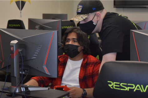 Senior Alexander Flores (left) and junior Frank Lopez strategize for their next game after a win by the opposing team’s forfeit Feb. 28. The newly formed four-member Halo team is currently 3-2 in the High School eSports League.