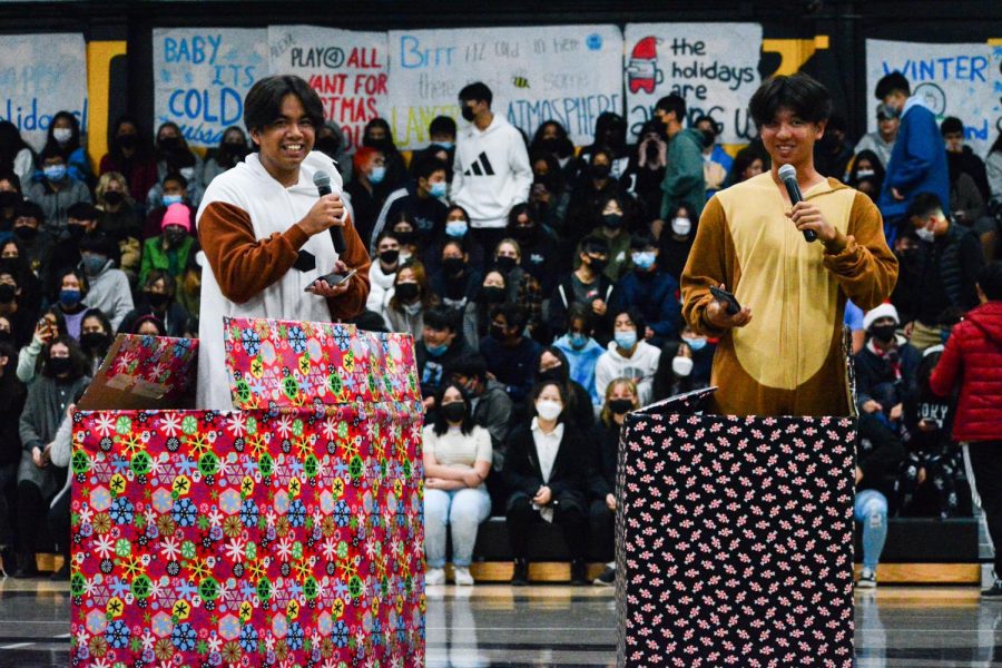 Seniors Patrick Jimenez (left) and Darian Choi spring out of gift boxes to commence the Winter assembly on Dec. 12, 2021 in the gym. In addition to assemblies returning to double second format, the Associated Student Body will move to third period for the next school year, adjusting to the new bell schedule.