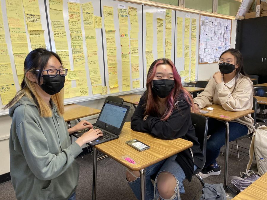 Writers Alliance president sophomore Binny Park (left) discusses possible names for their literary magazine with sophomores Hannah Choi (middle) and Chloe Chun during a lunch meeting May 9. 