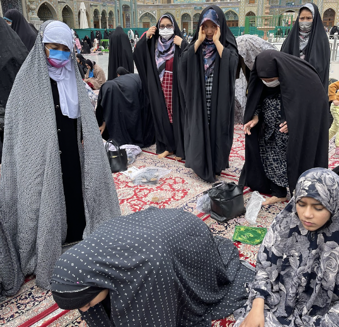 Senior Rida Zar and members of her family pray at the shrine of Bibi Masuma during a trip to Iran in March.