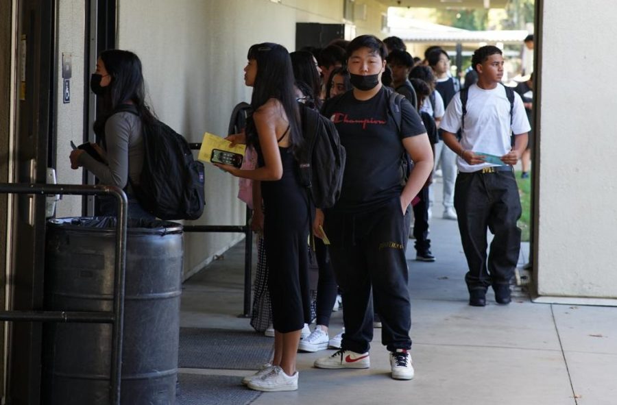 Students who didn’t attend Lancer Days line up in front of the Lyceum at the beginning of school on Monday, Aug. 15, to pick up their class schedules.