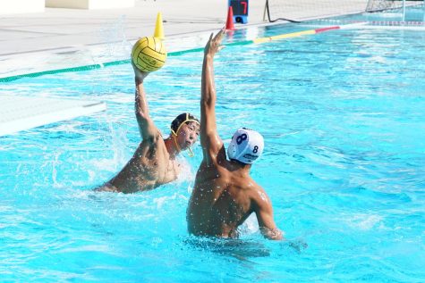 Utility player junior Brandon Koh (left) gets ready to fire the ball toward the goal in an Aug. 25 home game against Chino Hills at the Sunny Hills pool.