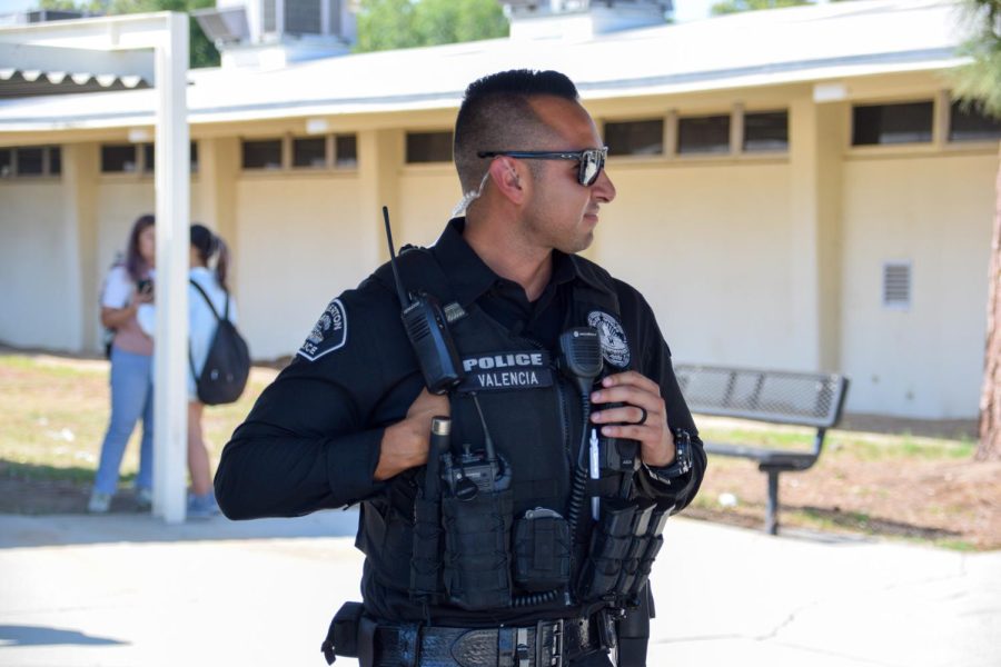 Fullerton Police officer Gene Valencia makes an effort to engage with students, staff while on campus.