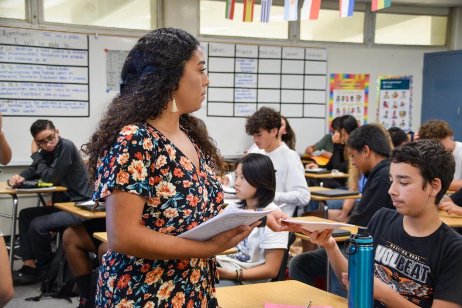 New World Language teacher Cindy Ruiz passes out papers to her fourth period Spanish 1 class on Tuesday, Aug. 16. Ruiz also coaches the girls frosh-soph soccer team.