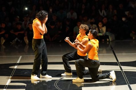 Football players seniors Mathias Brown (center) and Tony Salas end their lip sync battle performance to “Crazy in Love” by Beyonce with a proposal to senior Drake Cortez. 