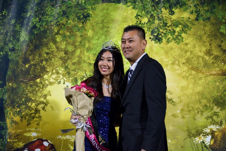 Senior Lindsey Kang (left) shares a special moment with her father after being crowned homecoming queen during halftime of the Friday, Sept. 30, football game between Sunny Hills and Fullerton at Buena Park High School stadium.