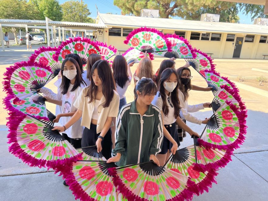 Korean Culture Clubs fan dance subgroup practices after school on Wednesday, Sept. 28, for its performance on the Saturday, Oct. 8, Korean Culture Festival that will take place at the Sunny Hills quad.