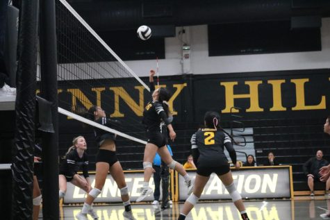 Setter senior Stacy Kim jumps up to block the oncoming ball during the second set of the CIF-SS playoffs against The Archer School for Girls on Oct. 22. The Lady Lancers won the match 3-0, which qualifies them for the quarterfinal round on Wednesday, Oct. 26.