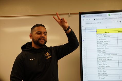 New social science teacher Matthew Acosta greets his fifth period United States History class Nov. 4. 