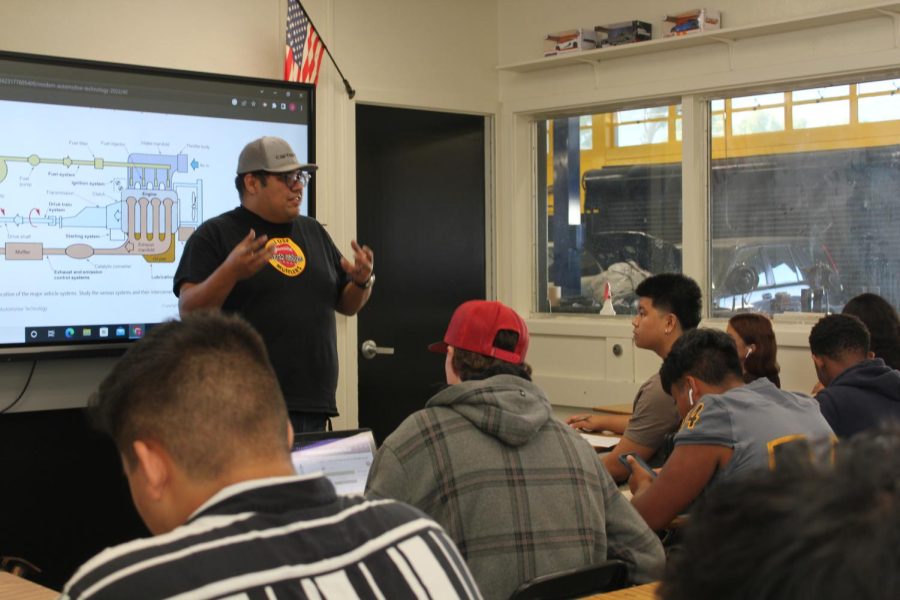 New auto tech teacher Jesse Munoz gives a lecture on how cars start last October in Room 131.