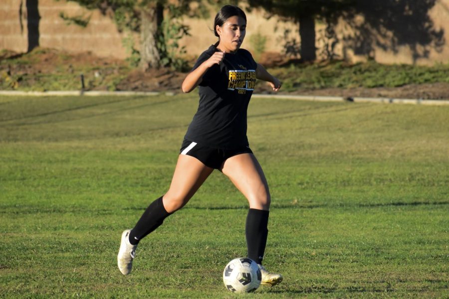 Midfielder junior Isabel Miramontes winds up to kick the ball into the netting during a Nov. 14, 2022, after school practice on the Sunny Hills field. 