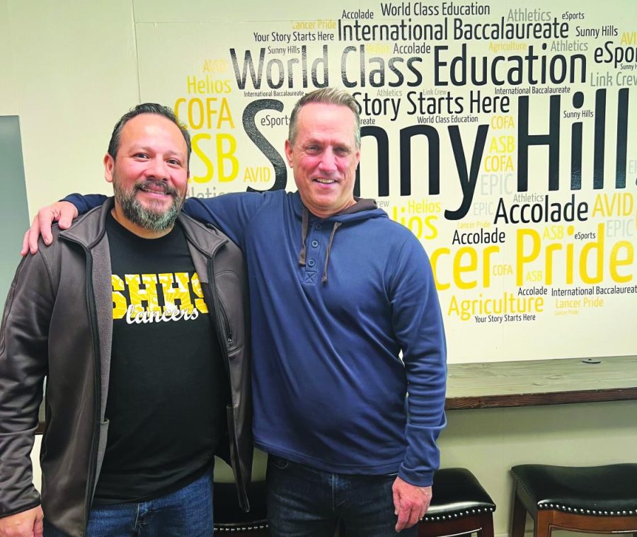 Site technician Anthony Jara (left) and International Baccalaureate coordinator and art teacher Brian Wall pose after their nomination as the employees of the year in Room 3 on Jan. 18.