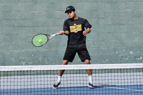 Junior Brian Lemus gets ready to hit a forehand at a practice on March 3 at Sunny Hills. 