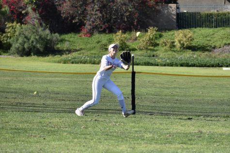 Pitcher sophomore Alexis Perez positions to catch a softball at the Sunny Hills field in an afterschool practice Monday, March 27. 