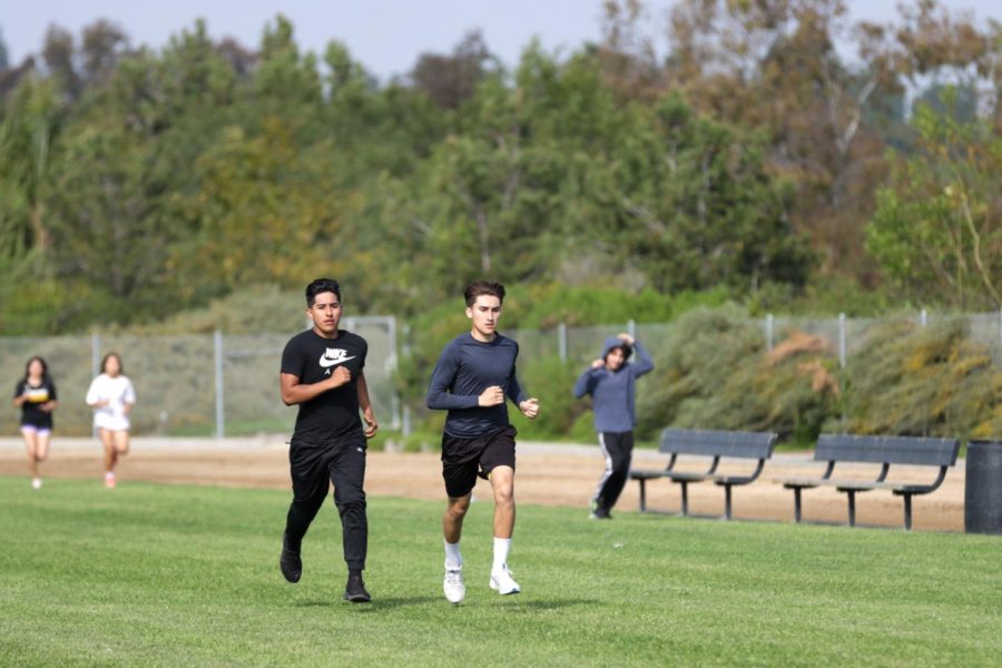 Seniors Tony Salas (left) and Victor Lang practice strides Monday, March 13, at the Sunny Hills track in preparation for their Tuesday, March 28, meet at Buena Park High School stadium.