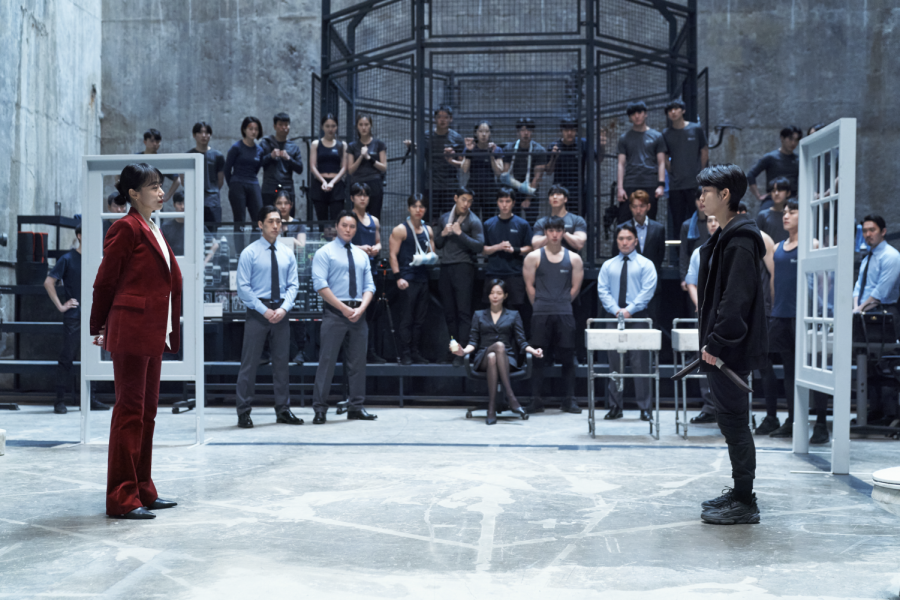 Despite the stigma surrounding her middle-aged status, Gil (left) proves her persisting agility in a demonstration performed in front of her juniors. 