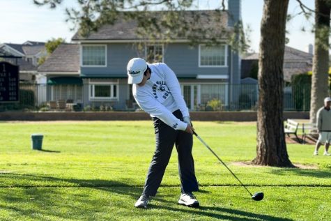 Sophomore Caleb Kim swings his driver to hit the golf ball at Alta Vista Country Club against the Valencia Tigers Tuesday, March 7. The Lancers won this preseason match 197-211.