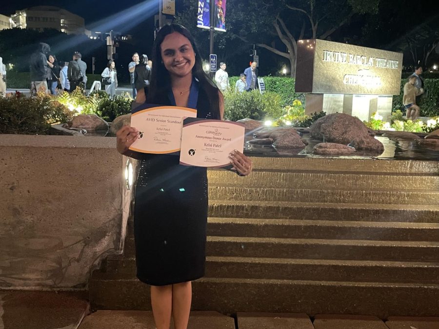 Senior Krisi Patel holds up her two honorary certificates as the 2022-2023 Advancement Via Individual Determination [AVID] Senior Standout April 18 at the Irvine Barclay Theatre, where Orange County AVID students were recognized.