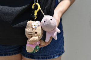 Junior Ashley Hong shows off her Hawaiian-themed Sanrio keychain (left) gifted by her friend and a pink octopus (right) from Amazon on May 17.