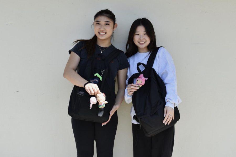 Juniors Ashley Hong (left) and Emma Jang show off their matching Sanrio keychains their friend gifted them after purchasing during her Hawaii trip on Thursday, April 20. 