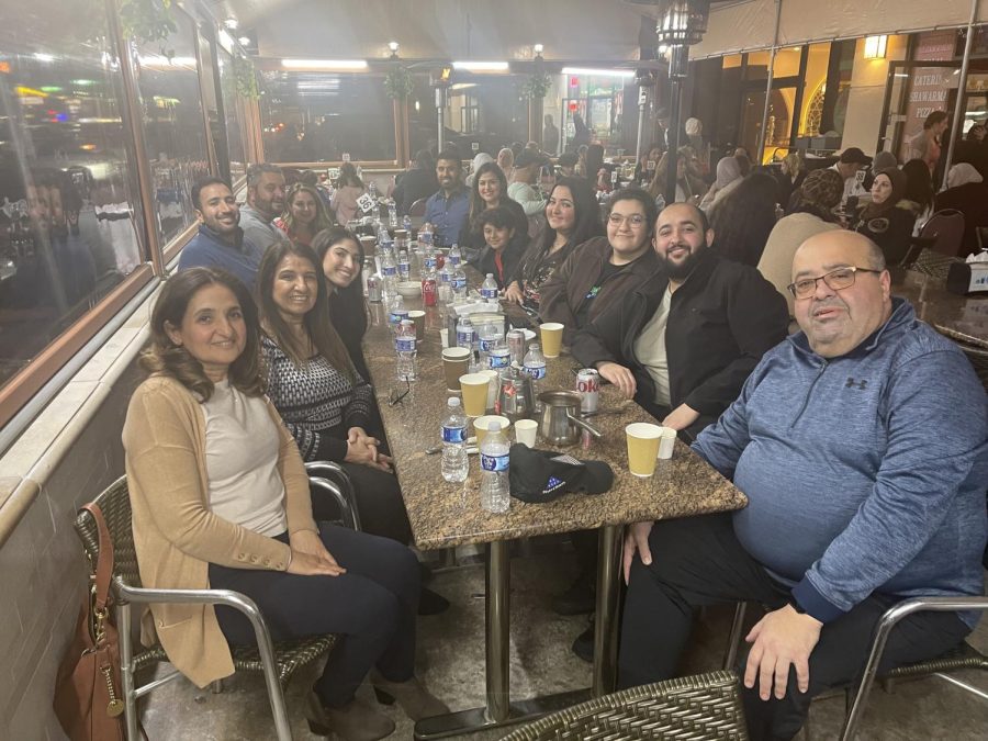 Junior+Dareen+Hagekhalil+and+her+family+break+their+fast+at+one+of+many+Iftar+dinners+throughout+the+month+of+Ramadan.+Iftar+is+the+fast-breaking+evening+meal+of+Muslims.