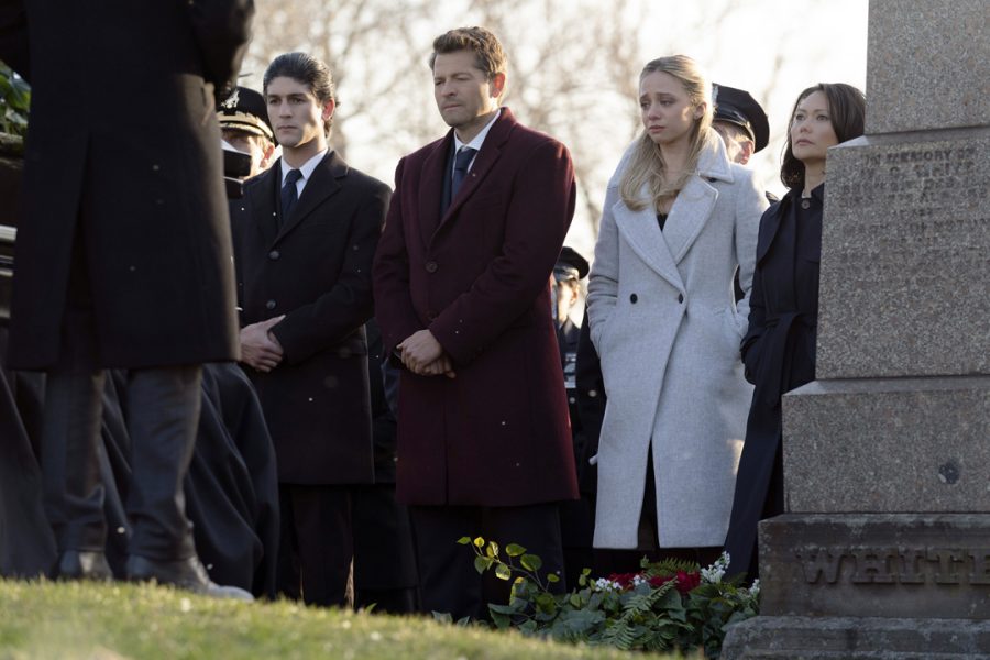 Despite the absence of the Caped Crusader in CWs new series, Gotham Knights, viewers may get to see the origin story of how the towns district attorney, Harvey Dent (actor Misha Collins, center) eventually turns into DCs famous villain, Two-Face. The prosecutor is joined by others from the community at Bruce Waynes funeral in the series pilot episode.
