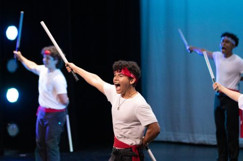 Senior Brigham Catota shouts a Mexican scream — known as a grito — to initiate the male dance, los machetes, as the fifth performance of the night.