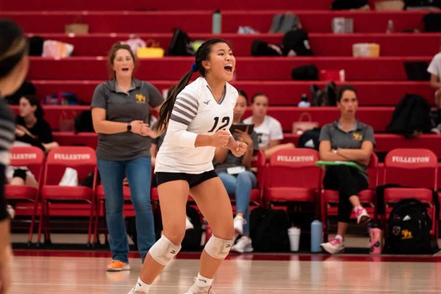 Libero+senior+Grace+Min+celebrates+a+point+against+the+Fullerton+Tribe+on+Sept.+29%2C+2022%2C+while+wearing+No.+12+jersey+in+the+Fullerton+Union+High+School+gym.
