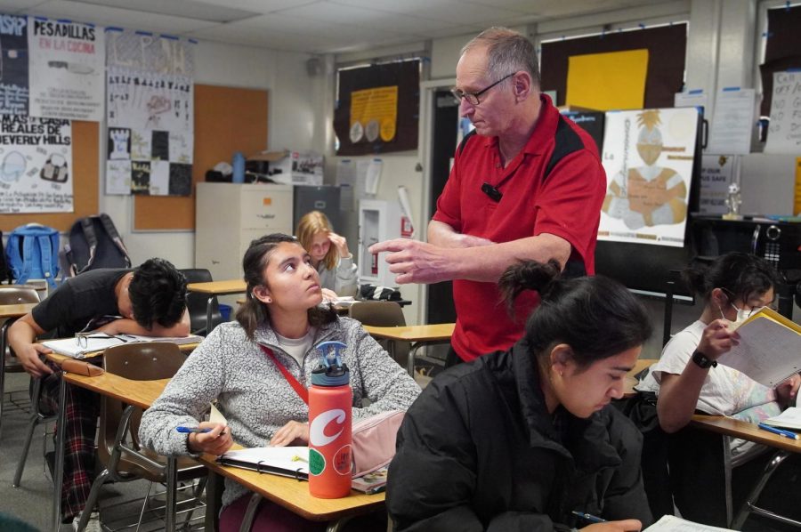 Spanish teacher Gene Bordy explains a concept to a student in his third period class May 4. The 2022-
2023 school term marks his
final year as an educator.
