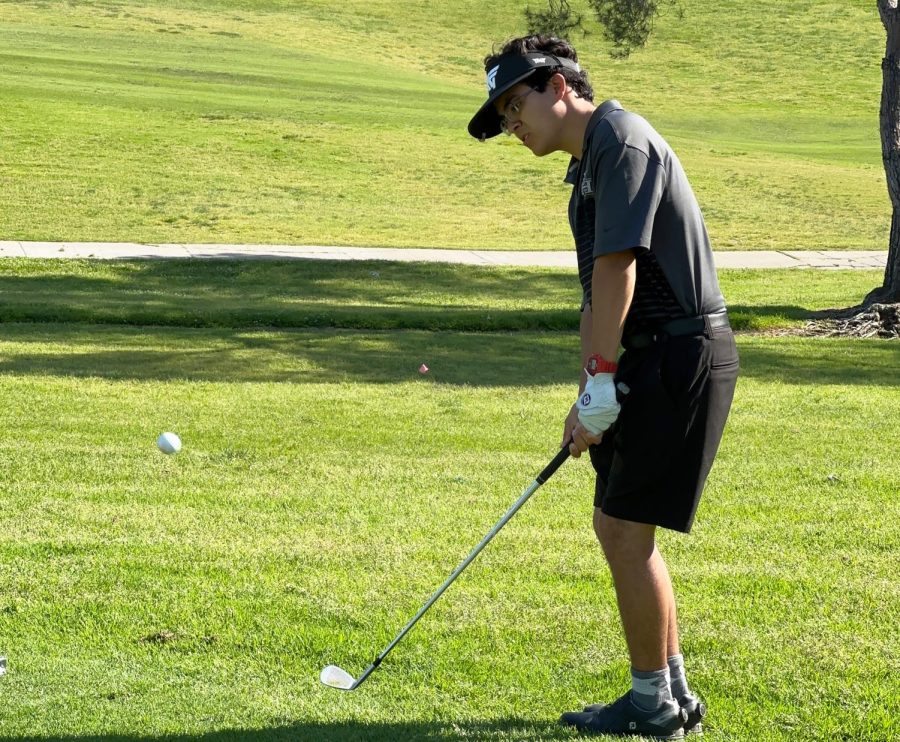 Junior Dino Torres swings his golf club at the La Mirada Golf Course before the boys golf team’s last Freeway League match against the Sonora Raiders April 27. The Lancers won 182-272, finishing Freeway League play undefeated and becoming league champions for a 19th consecutive season.