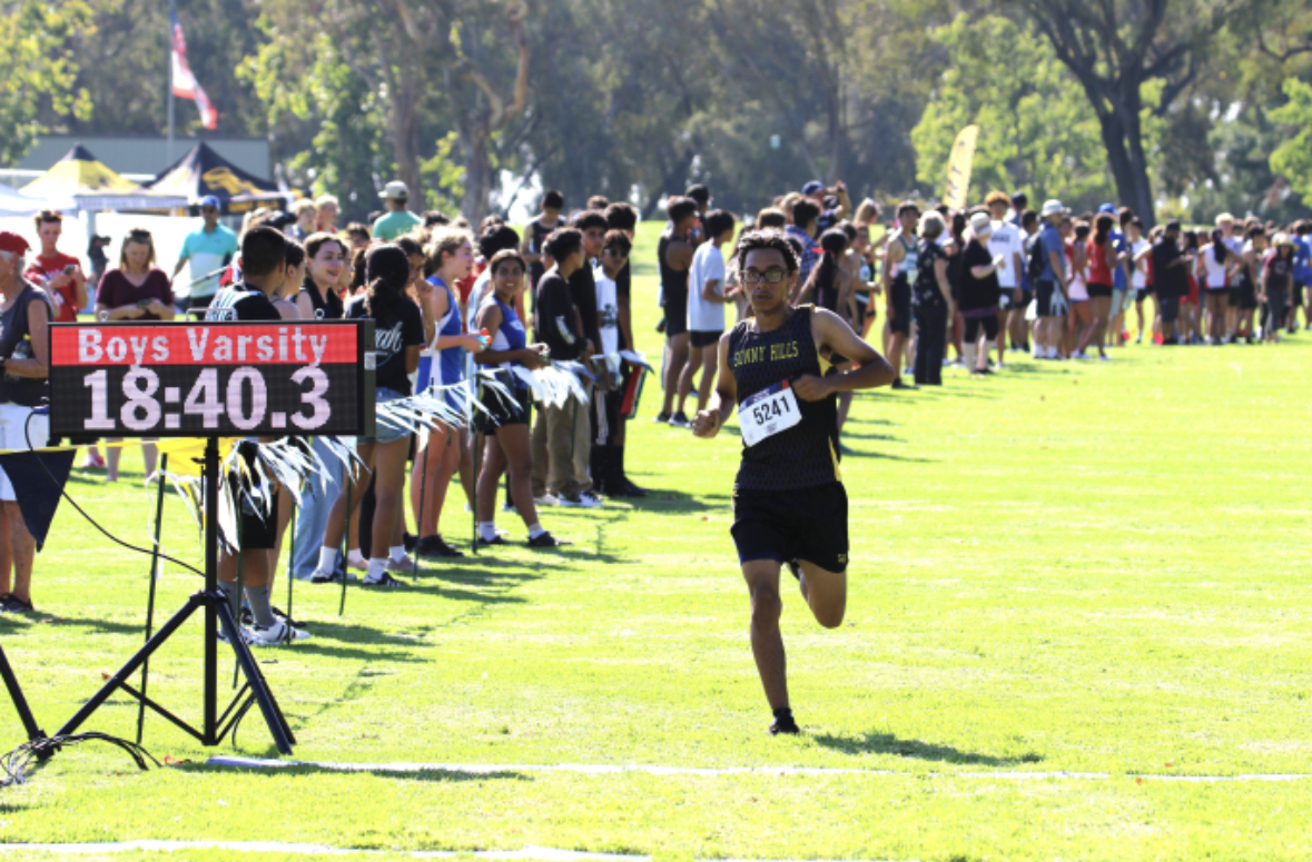 Junior Alex Rivera runs to finish his third and last mile during the first Freeway League Cluster at Ralph B. Clark Park in Buena Park on Wednesday, Sept. 6. The Lancers placed fourth overall as a team. 
