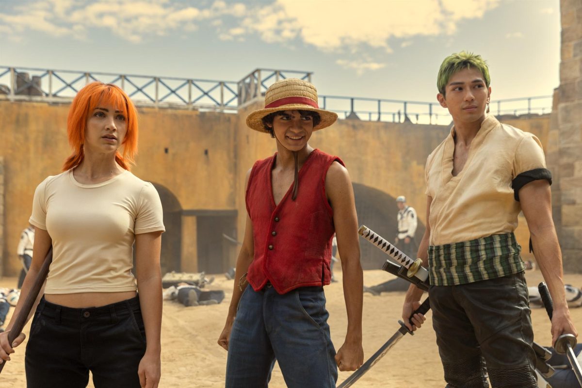 Nami (left), Monkey D. Luffy and Zoro stand victorious after a battle against marine soldiers and captain Morgan, also known as Axe-Hand Morgan, in episode one of Netflix’s newest live action adaptation of the anime series “One Piece.” 
