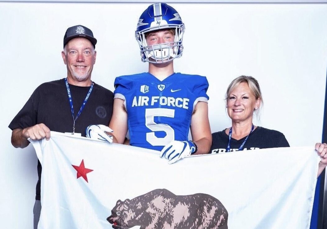 Senior+Connor+Irons+%28center%29+wears+an+Air+Force+Academy+jersey+while+standing+next+to+his+parents+and+holding+a+California+flag.+The+three+celebrated+Irons%E2%80%99+commitment+to+play+football+for+the+Air+Force+with+a+full-ride+scholarship+during+their+visit+to+the+military+university+in+Colorado+earlier+this+summer.+Irons+has+played+as+a+defensive+end+on+the+football+team+for+four+years%2C+being+the+captain+for+his+senior+year.
