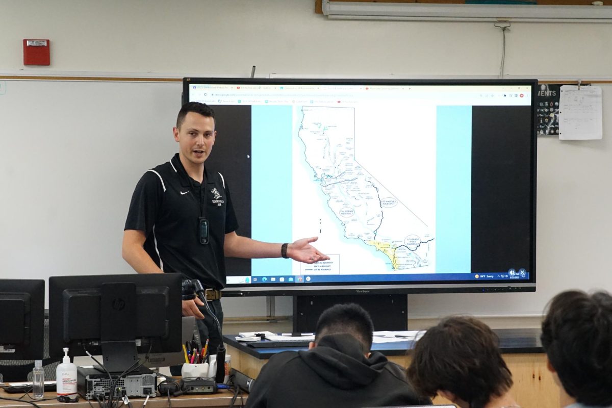 New science teacher Westley Fairall explains Wednesday, Aug. 23, to his fourth period Advanced Placement Environmental Science class in Room 104 how Mono Lake serves as an example of a terminal body of water. Fairall is one of two new science teachers this school year.