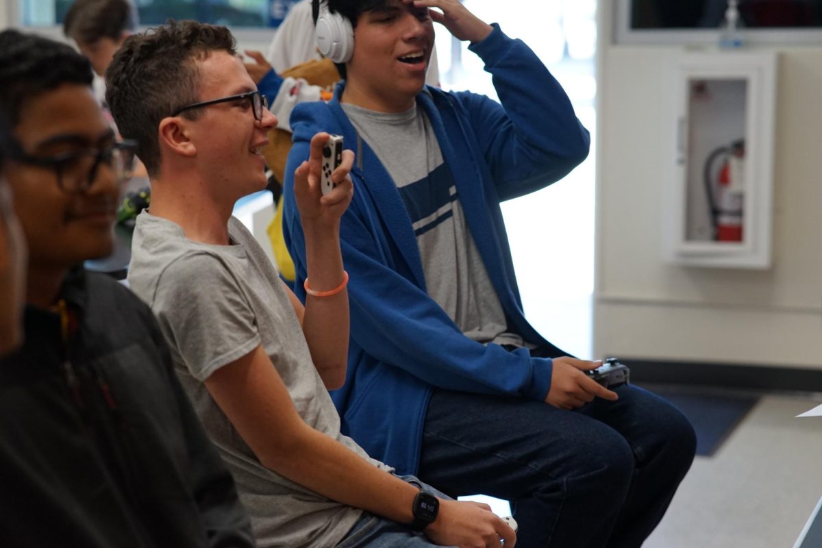 Seniors Dakota Ouzts (left) and Michael Marquez react as they battle against each other in a game of Super Smash Bros. Ultimate during an open tournament on Friday, Sept. 8, after school in Room 111. Marquez won 2-0, proceeding to the winner’s bracket.