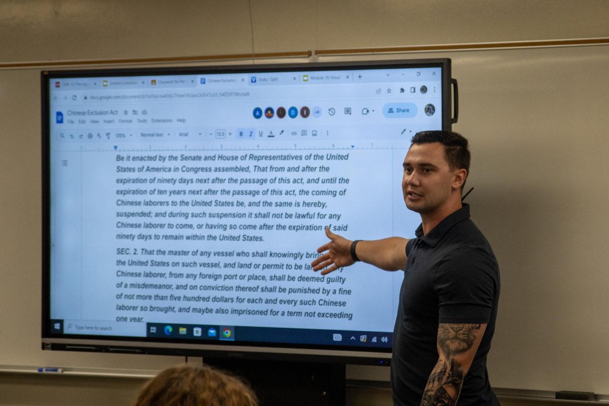  Social science teacher Troy Nelson explains the Chinese Exclusion Act to his fourth period U.S. History class in Room 56 on Wednesday, Aug. 30. 