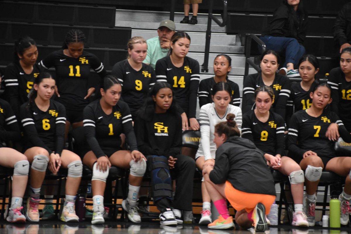 Girls volleyball head coach Amanda Donaldson talks to the Lady Lancers after calling a timeout in the first set against Claremont on Thursday, Oct. 19. 