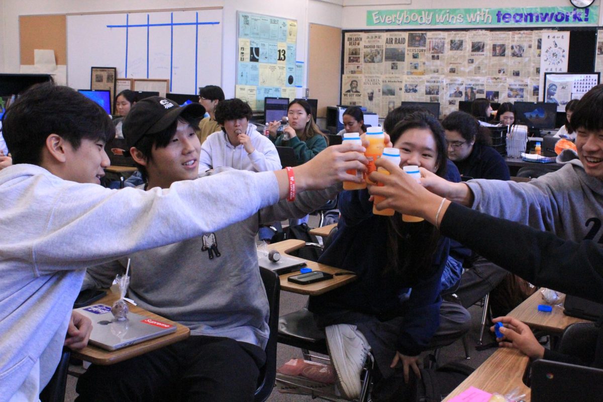 The Accolade staff members celebrate the publications Pacemaker recognition with SunnyD drinks that adviser Tommy Li distributed during fourth period on Monday, Nov. 6, along with a variety of cake pop flavors.